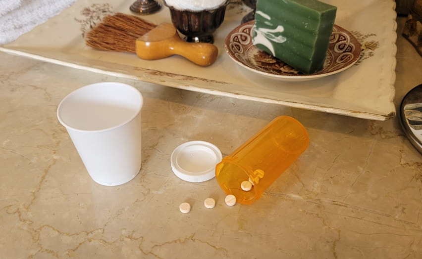 Back pain and Neck pain - Pain pills scattered on the sink.