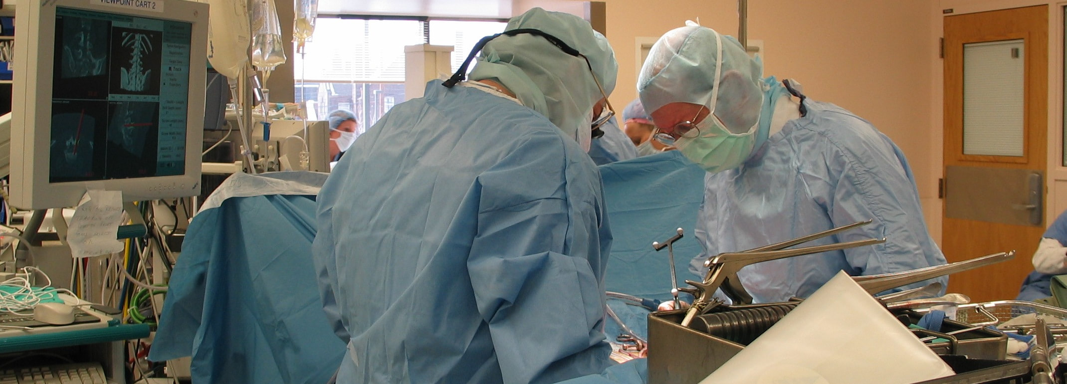 Spine surgeons at work in the operating room.